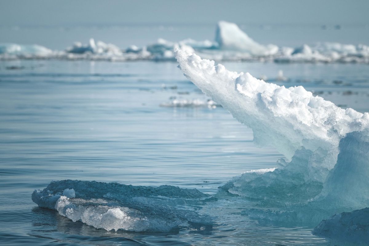 Iceberg floating in the ocean with most of its mass hidden underwater, symbolizing the subconscious mind's role in financial decisions
