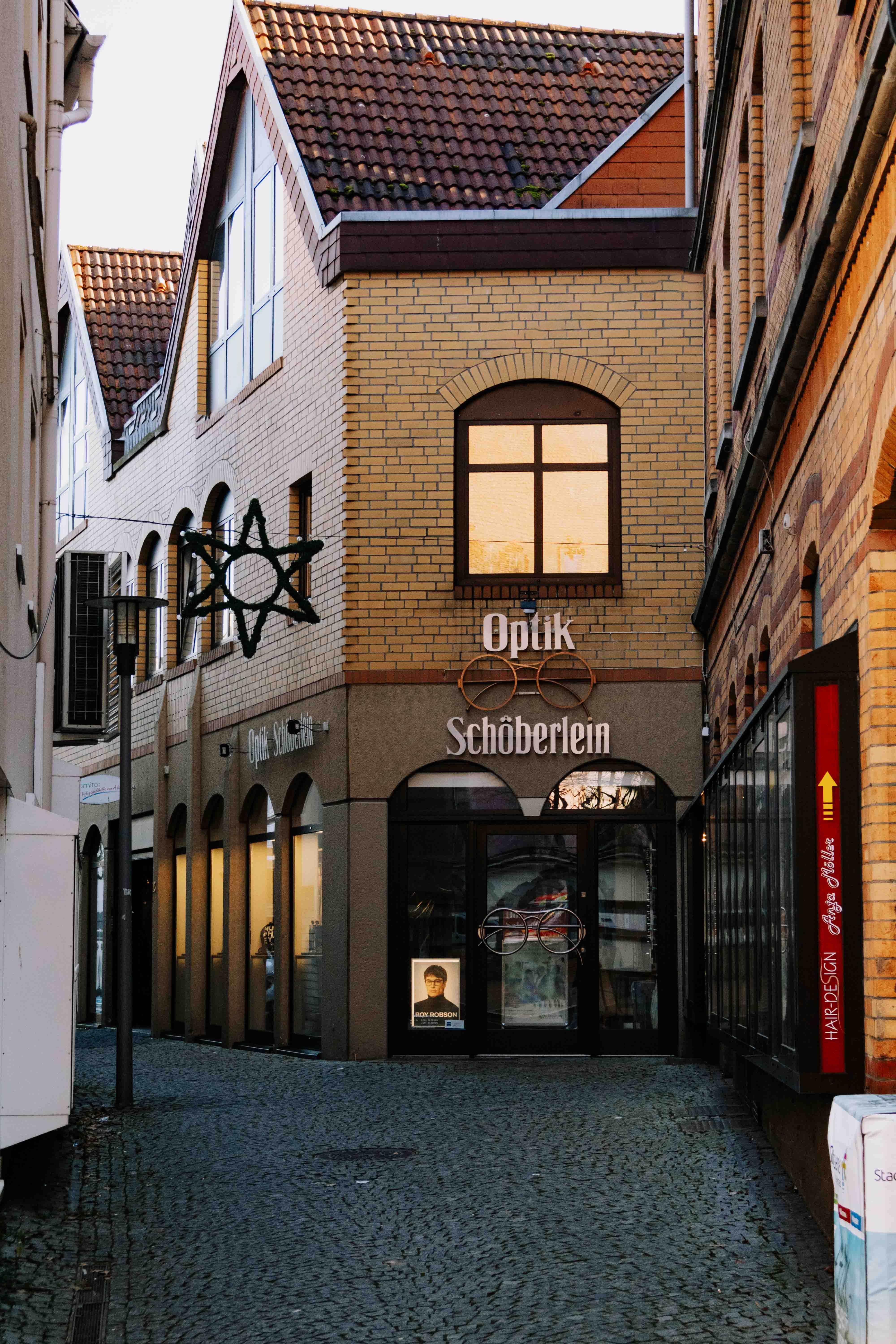 Elegant alleyway in Bad Hersfeld showcasing classic architecture at sunset.