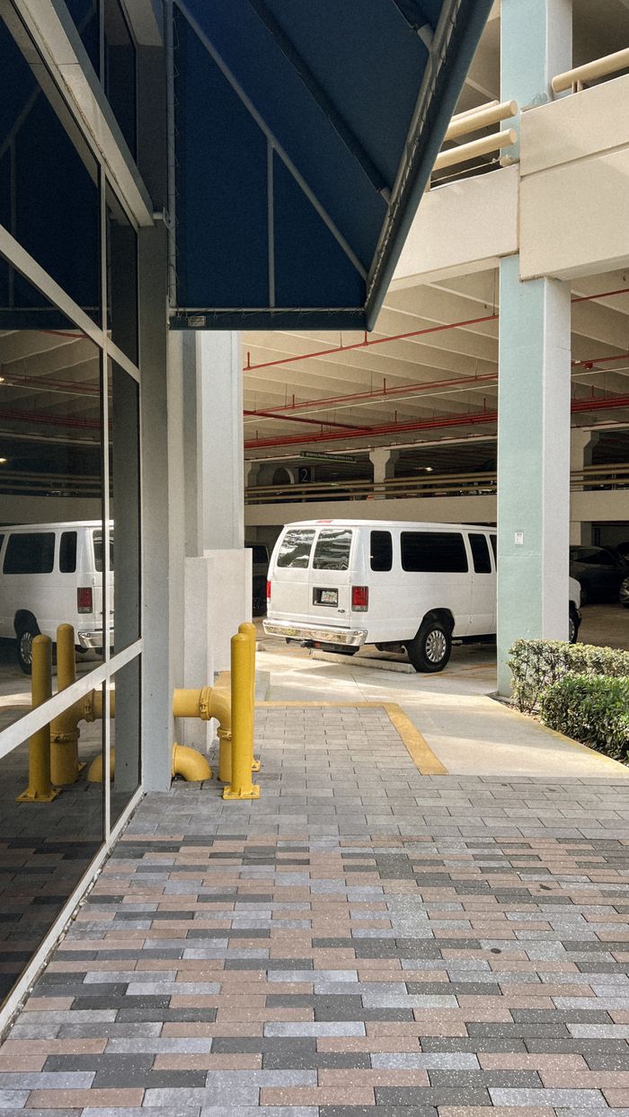Vehicles parked inside an urban parking garage