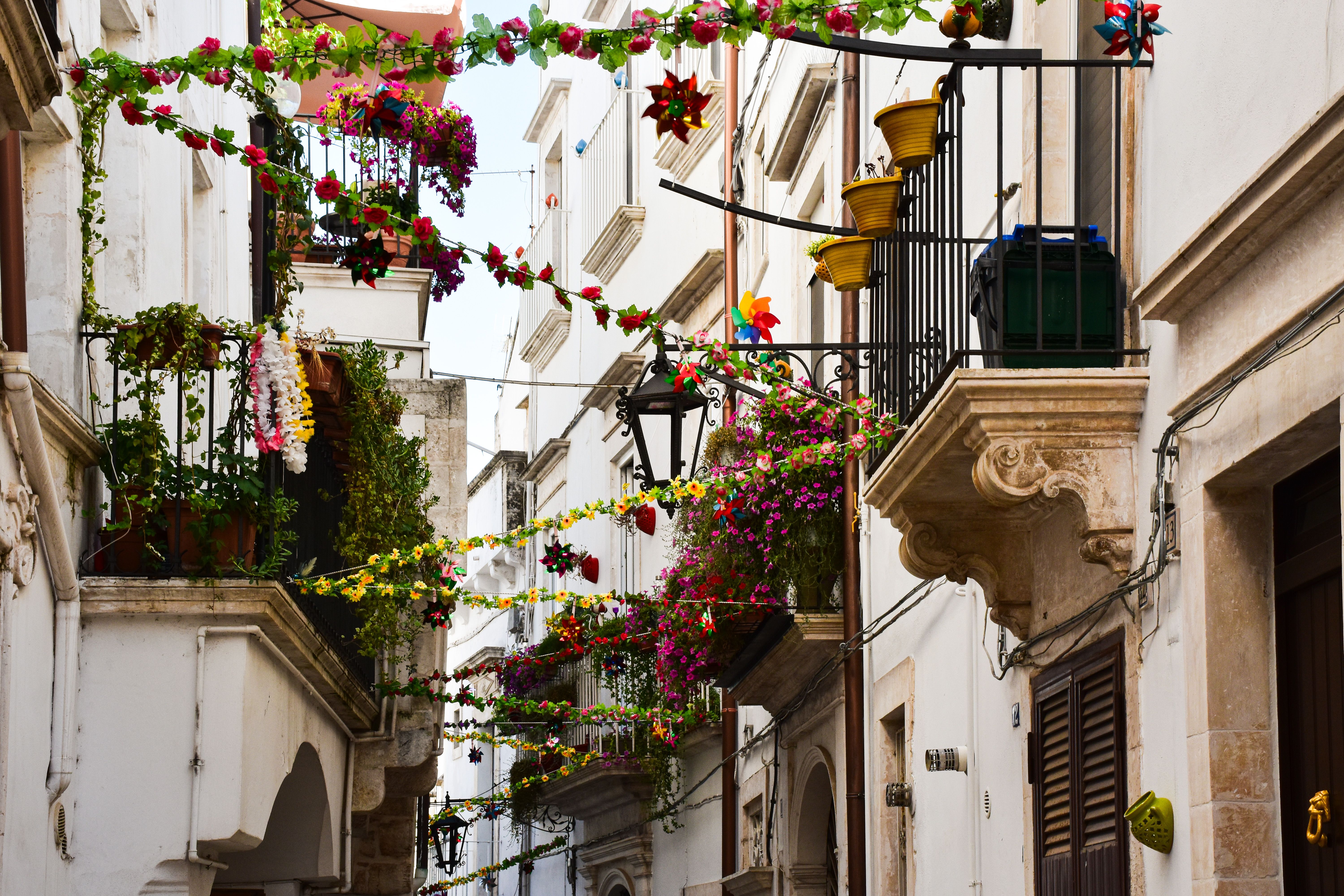 Colorful Italian Street with Floral Balconies · Free Stock Photo