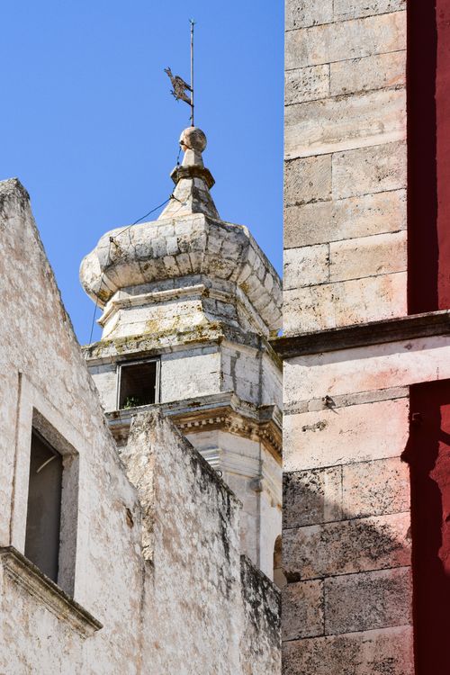 Free Close-up of historic architecture showcasing Puglia's unique stone buildings under a clear sky. Stock Photo