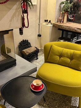 A warm and inviting cafe interior with a cup of coffee on a table.