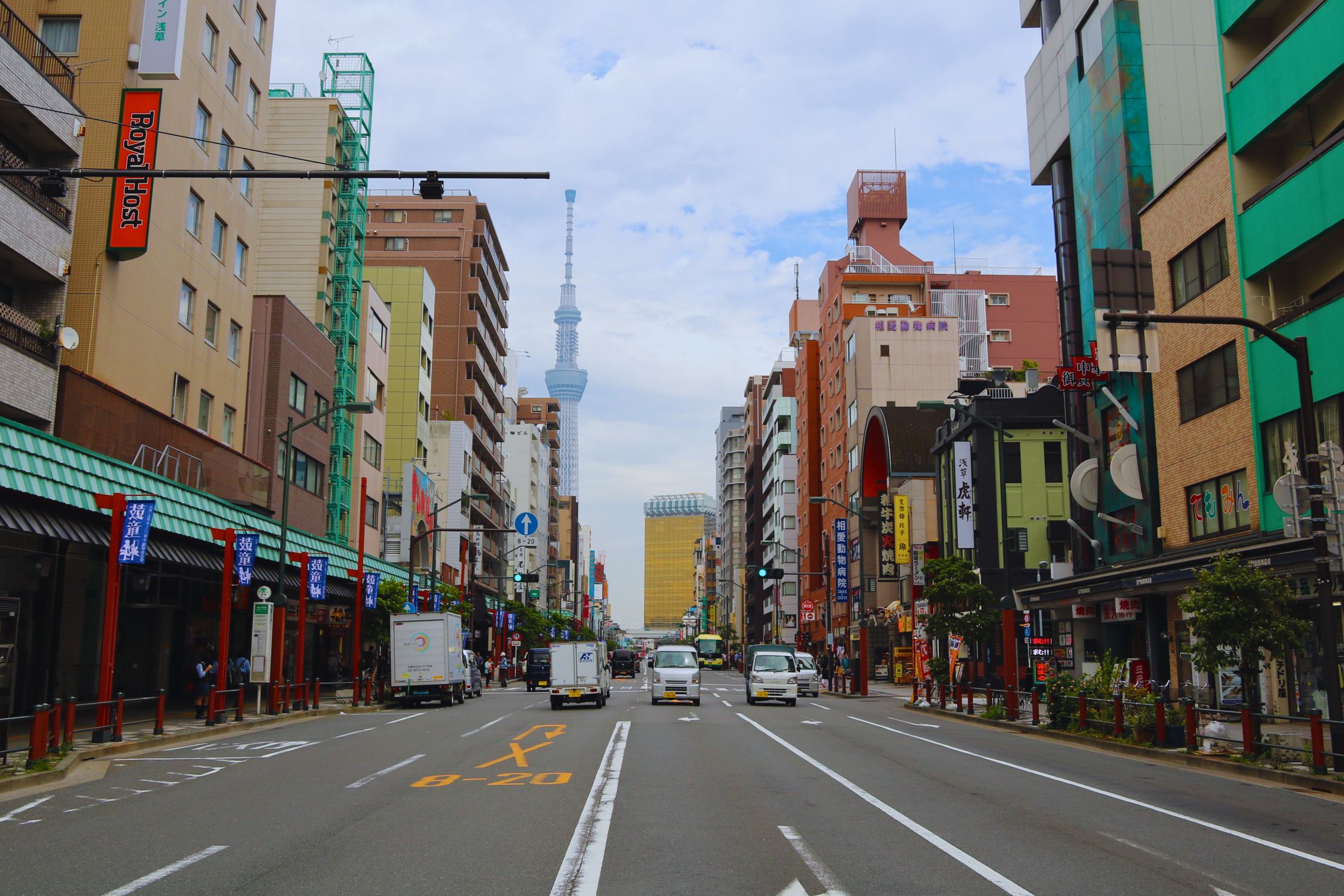 Vibrant street view in Tokyo with Skytree tower and bustling activity, capturing urban life
