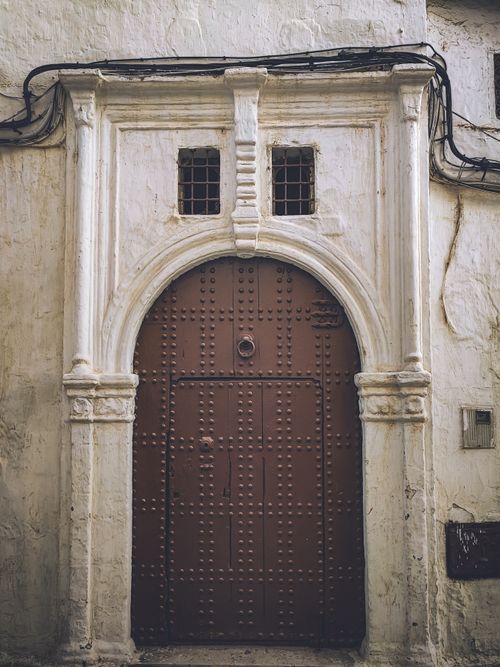 Free Classic Moroccan door with intricate design in a historic Rabat alley. Stock Photo