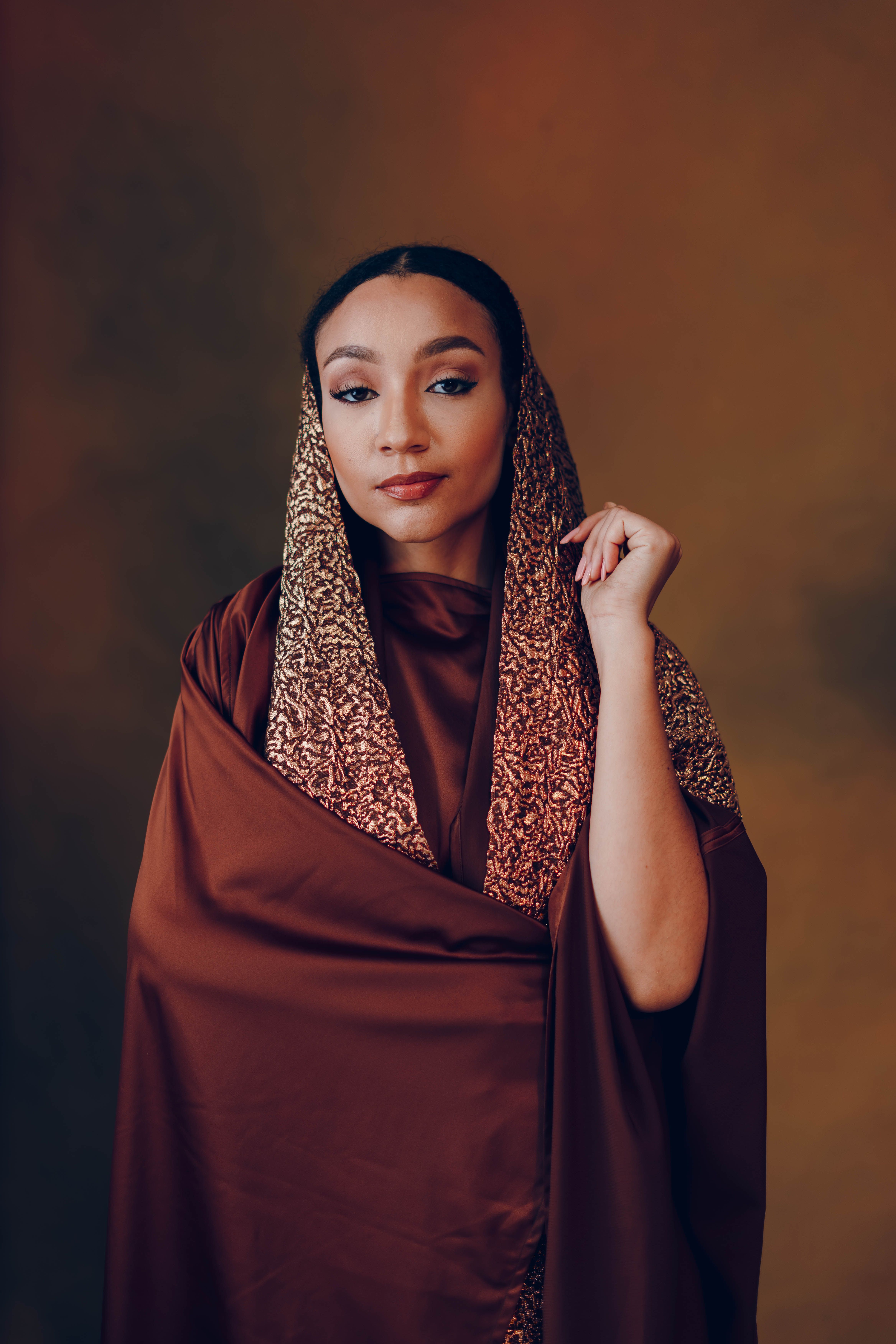 Elegant Portrait of Woman in Rich Brown Hijab · Free Stock Photo