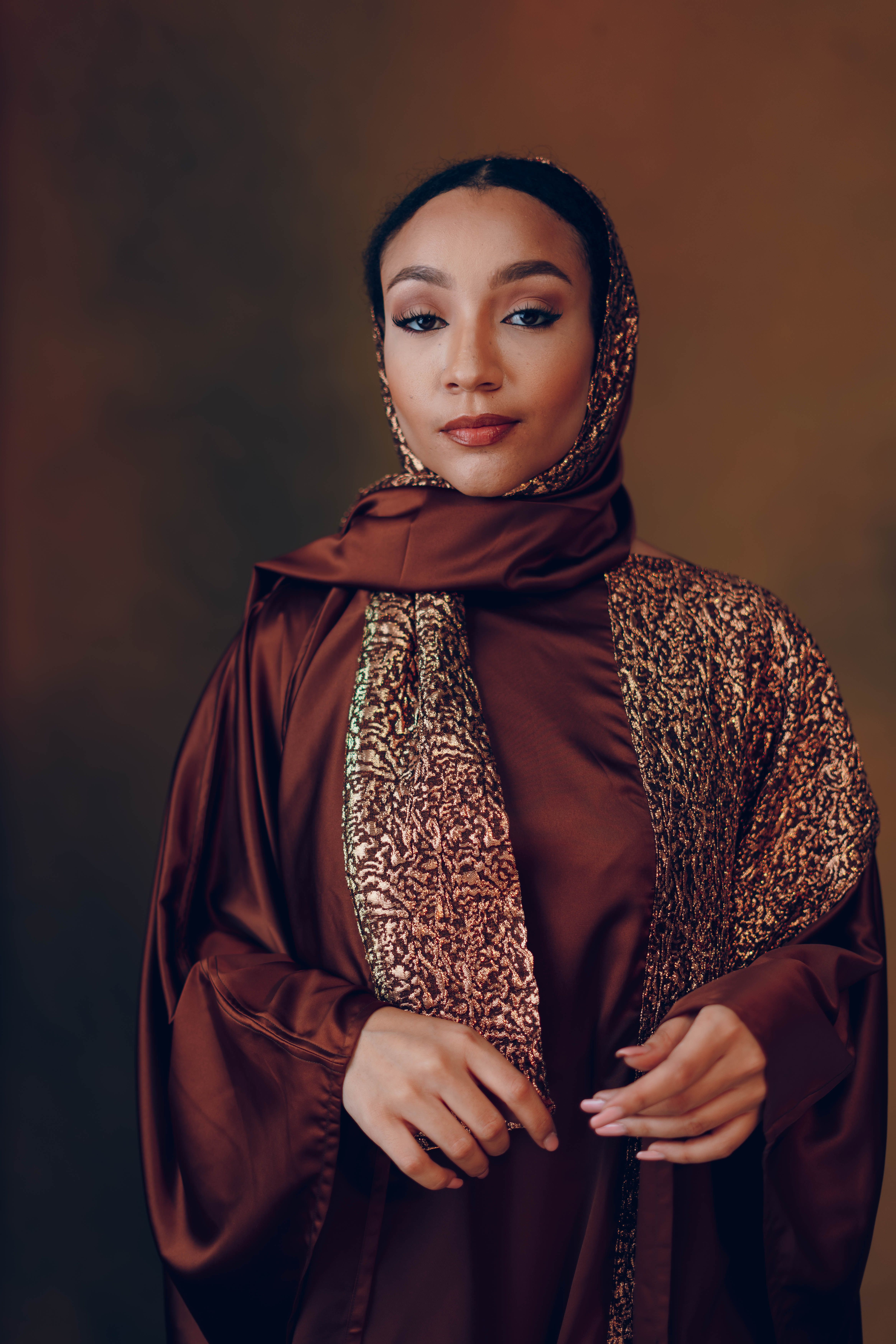 Elegant woman in traditional brown hijab · Free Stock Photo