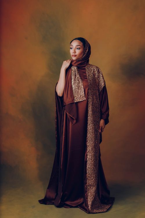 Elegant woman in traditional brown hijab · Free Stock Photo
