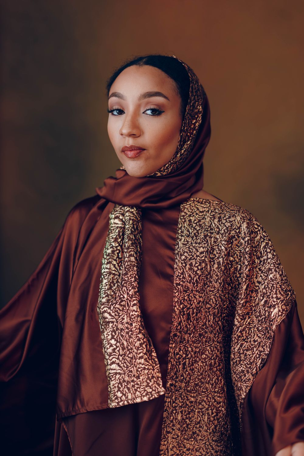 Elegant Woman in Brown and Gold Hijab Portrait · Free Stock Photo