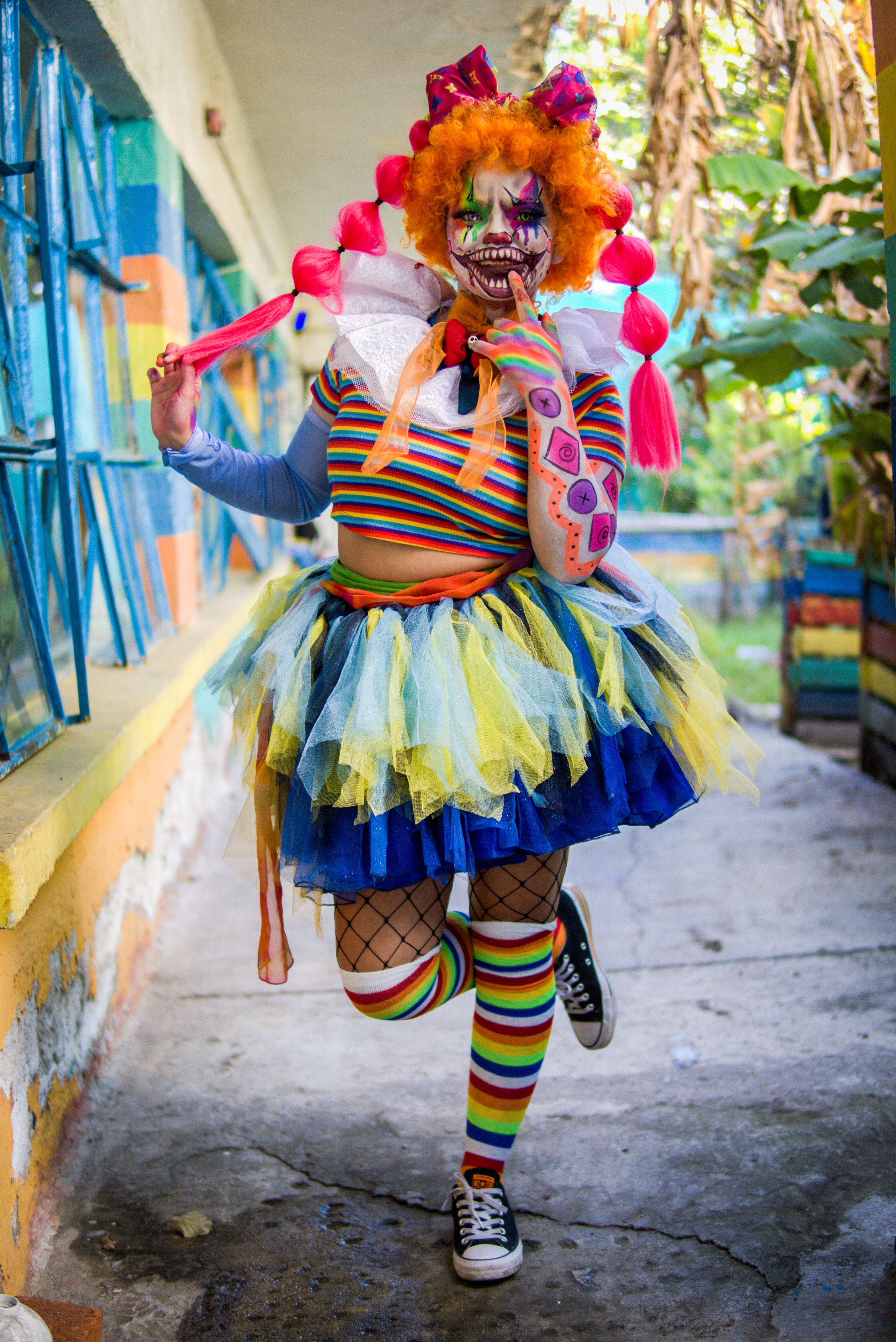 Colorful Clown Costume in Outdoor Setting · Free Stock Photo
