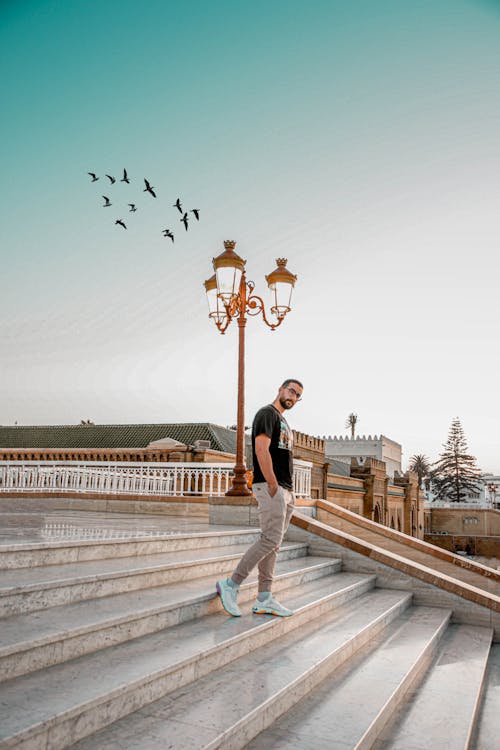 Free Photo Of Man Standing On Stairs Stock Photo