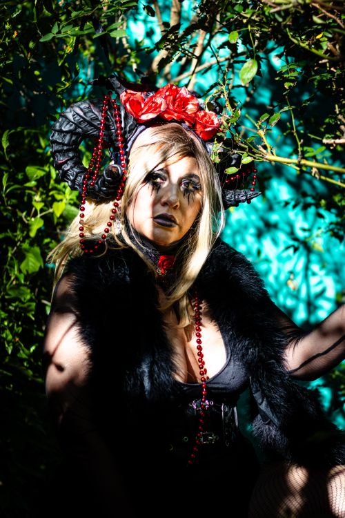 Free A gothic themed portrait featuring artistic makeup and intricate costume design. Stock Photo