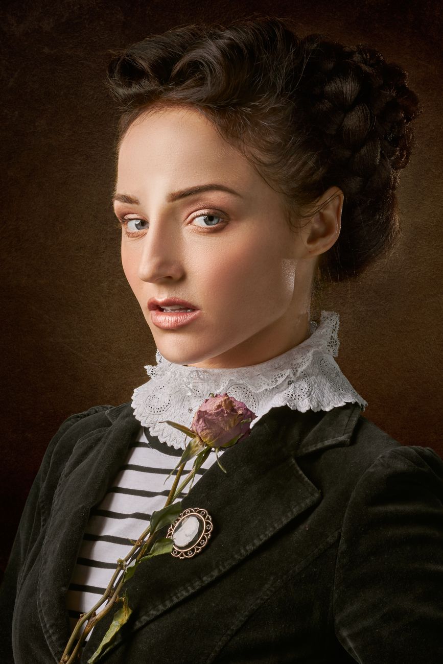 Classic Victorian portrait of a woman holding a flower, with intricate details and styling.. classic, victorian, portrait