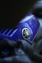 Close-up of Blue Motorcycle with Brand Logo