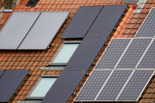 Close-up of solar panels on a tiled roof, showcasing sustainable energy solutions.