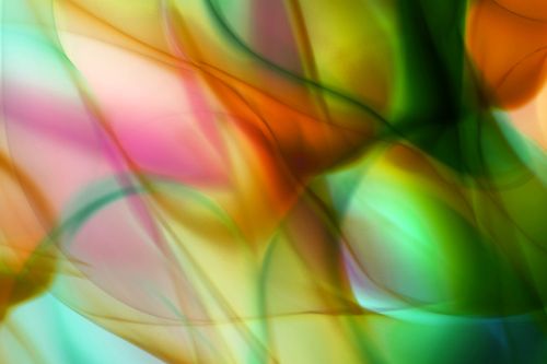 Free Vibrant abstract image of flowing colors and shapes resembling ribbons of light and shadow. Stock Photo