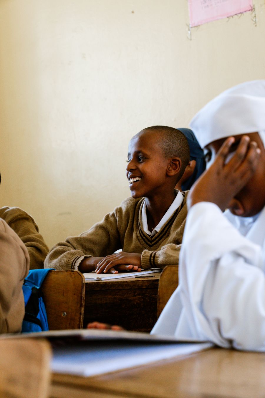 Student smiling in classroom