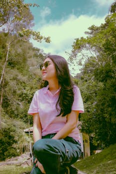 A woman enjoying nature in the lush greenery of West Java, Indonesia.