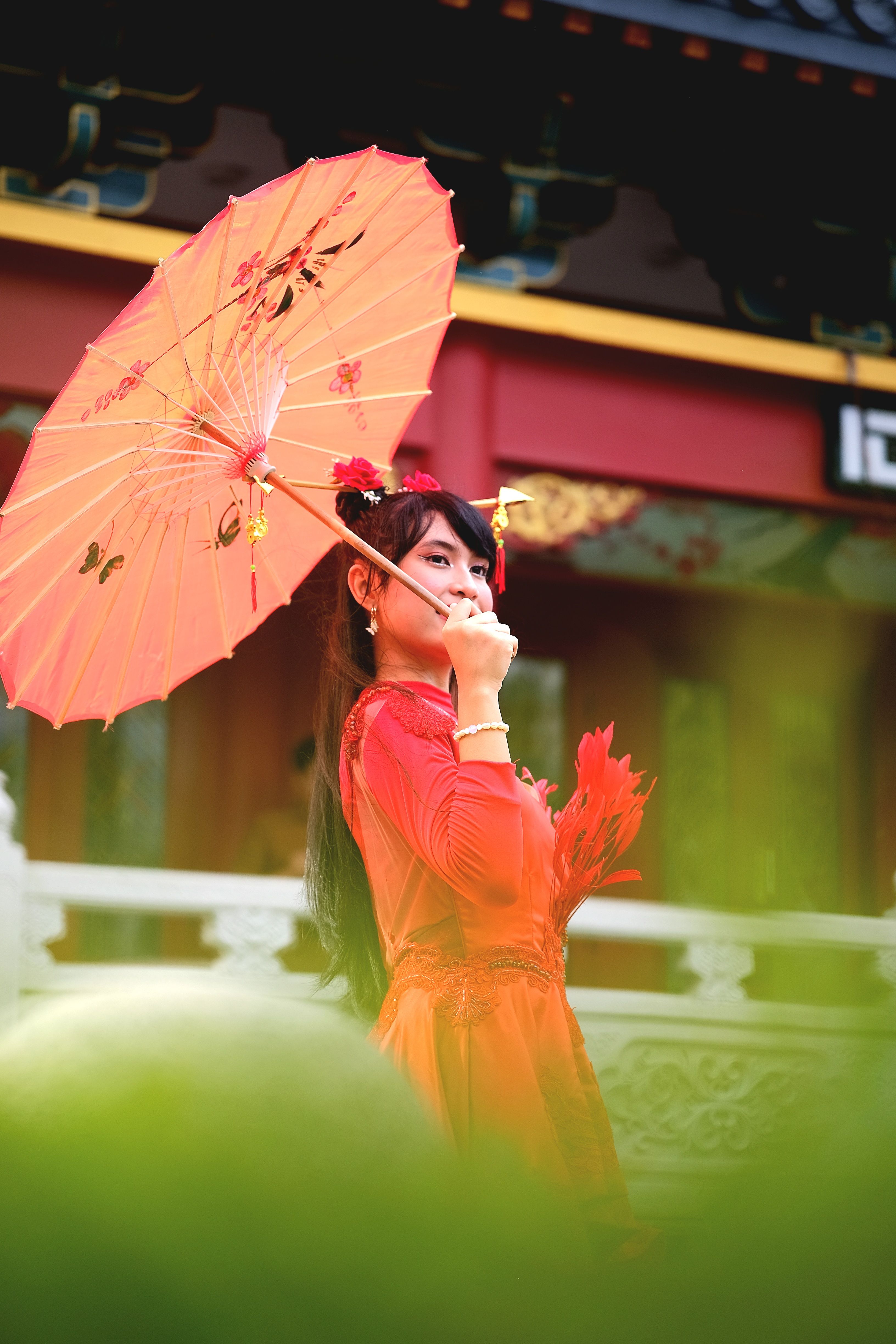 Elegant Woman in Red Dress with Traditional Umbrella · Free Stock Photo