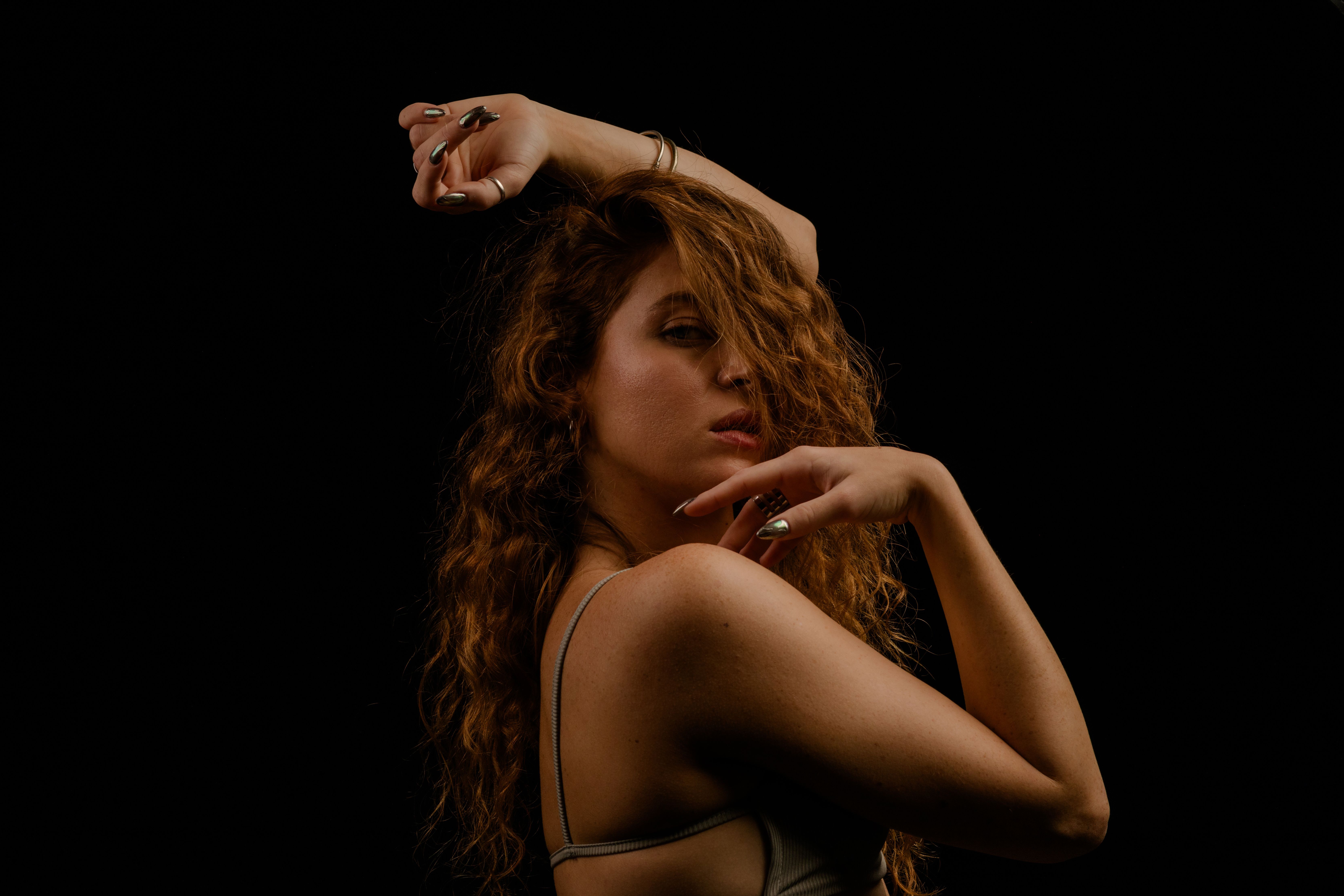 Artistic Portrait of Woman with Red Curly Hair · Free Stock Photo