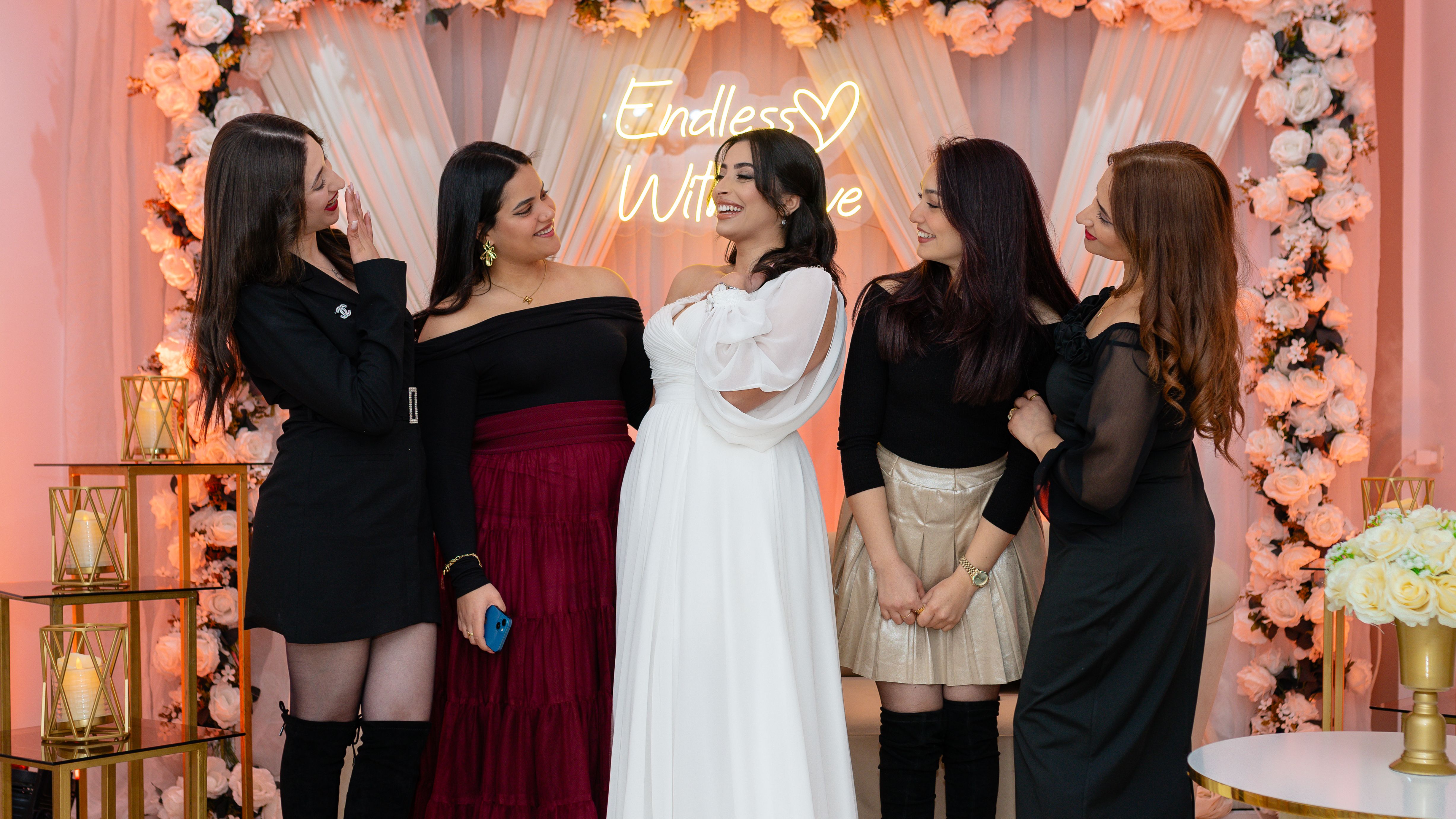 A joyful group of women in an elegant setting at Nabeul, Tunisia celebrating together.