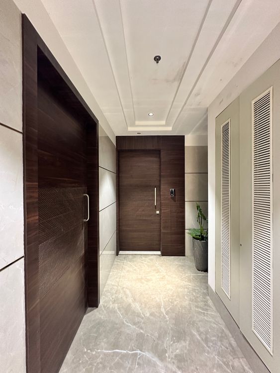 Modern Minimalist Hallway with Wooden Door · Free Stock Photo