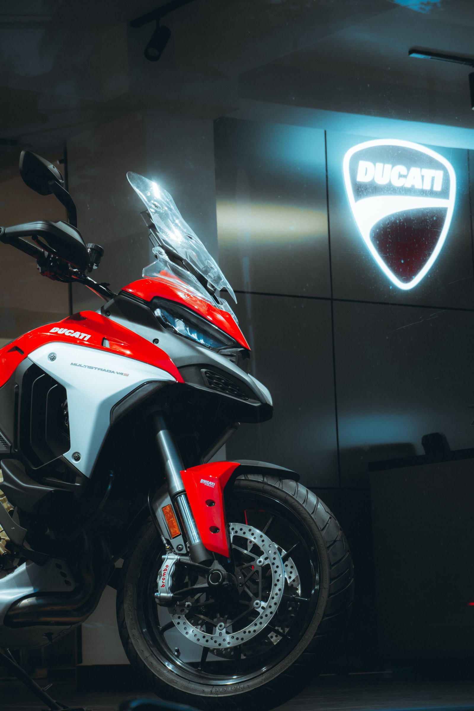 Adventure motorcycles displayed inside a modern showroom