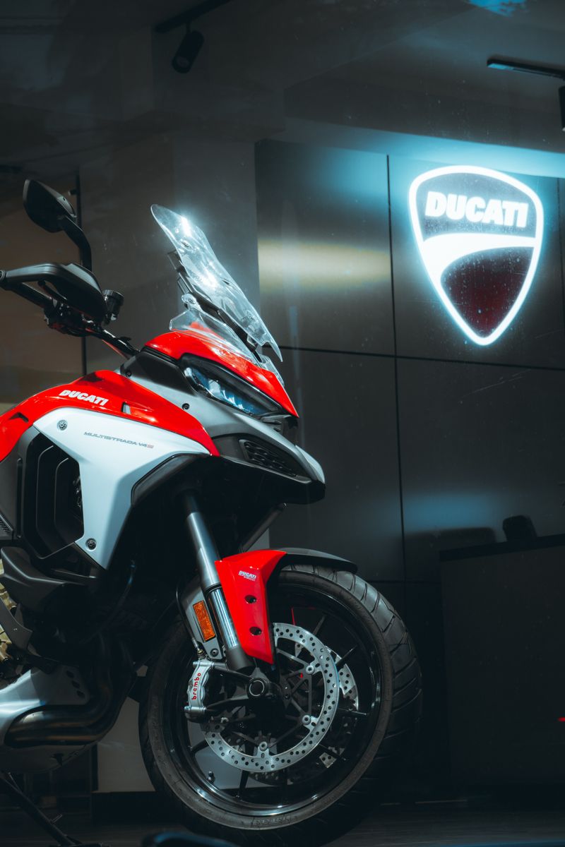 Close-up of a Ducati motorcycle display in a showroom