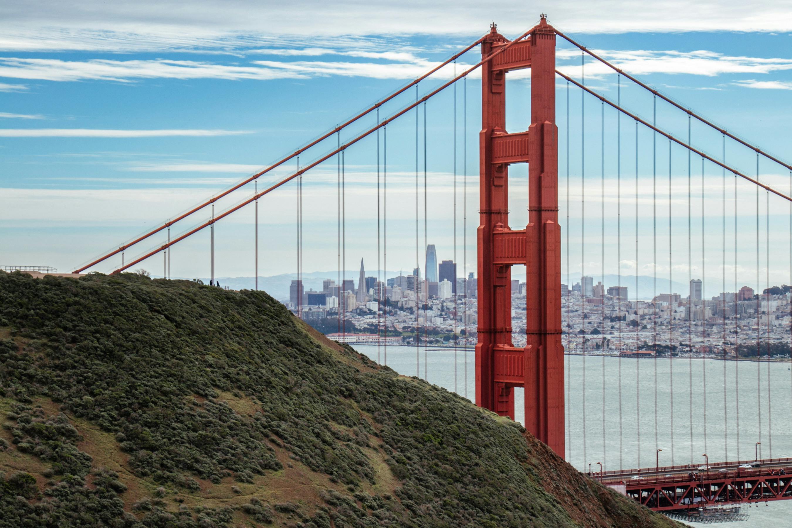 Stunning view of the Golden Gate Bridge with San Francisco cityscape in the background.