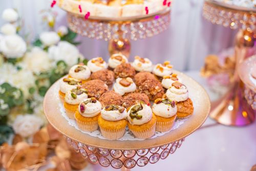 Free A beautifully arranged platter of assorted cupcakes, perfect for weddings or special occasions. Stock Photo