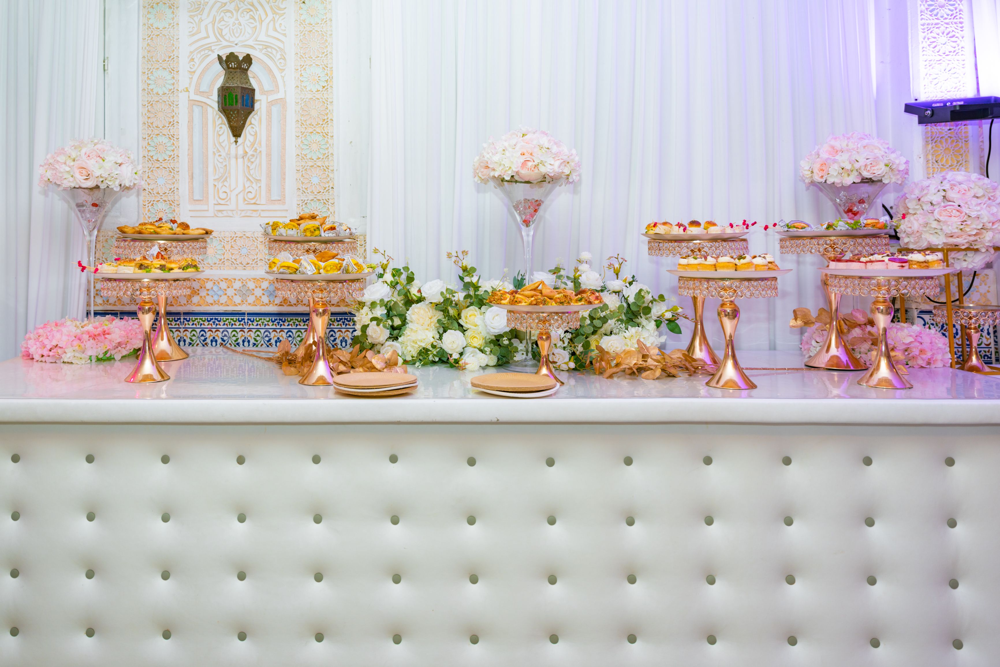 Traditional Moroccan desserts displayed on a decorative table