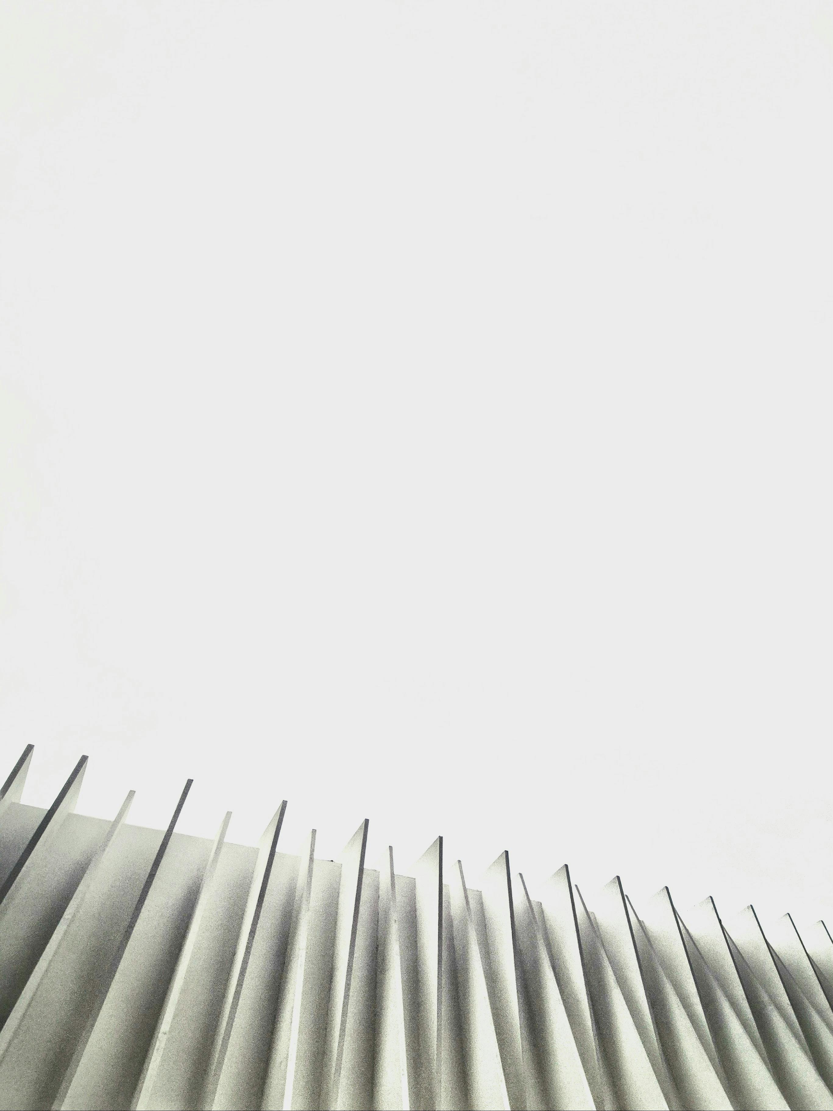 Free Minimalist abstract view of modern architecture with sharp linear patterns in neutral tones. Stock Photo