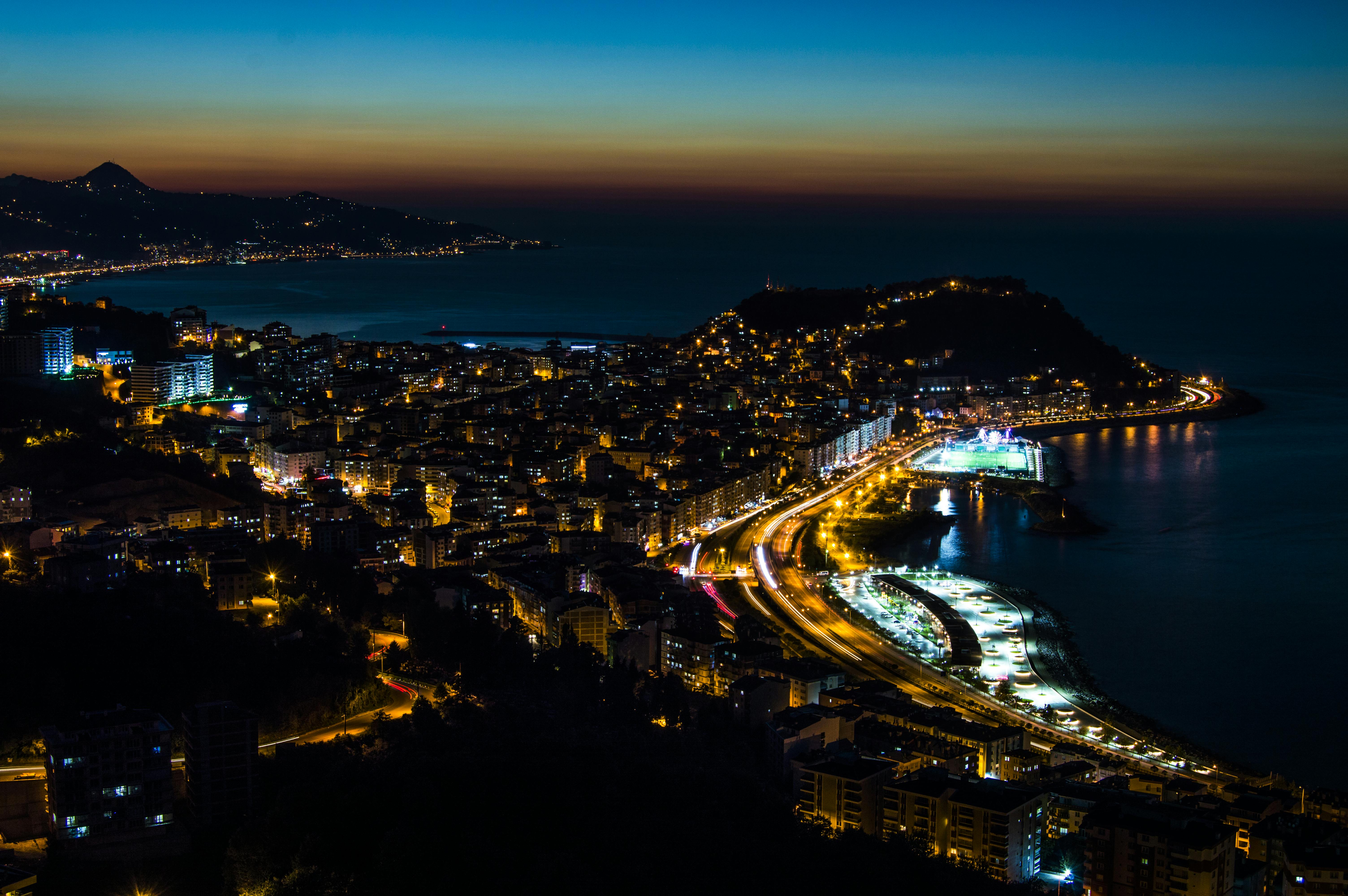 Twilight over Giresun, Türkiye with illuminated cityscape and beautiful coastline.