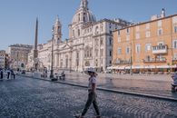 Woman Standing Near White Dome Building