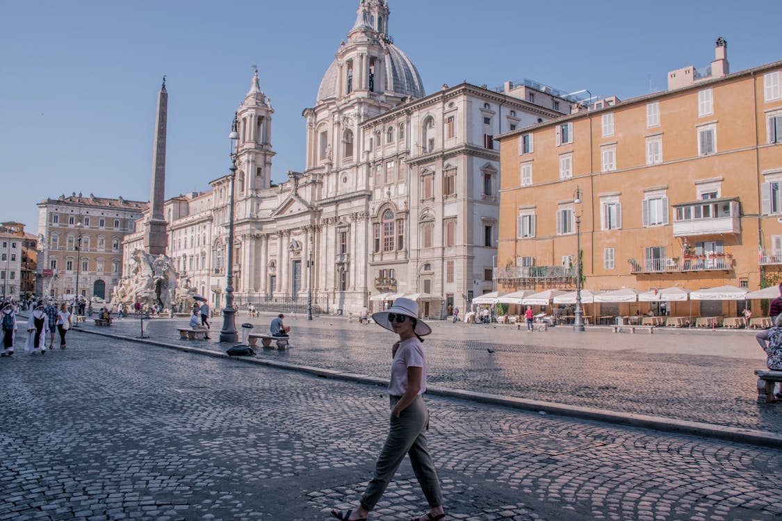 Woman Standing Near White Dome Building