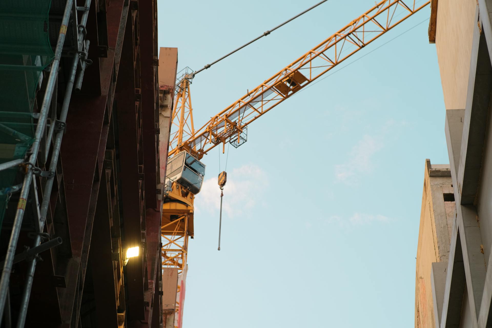 A construction crane dominates the urban skyline of Bratislava, Slovakia.