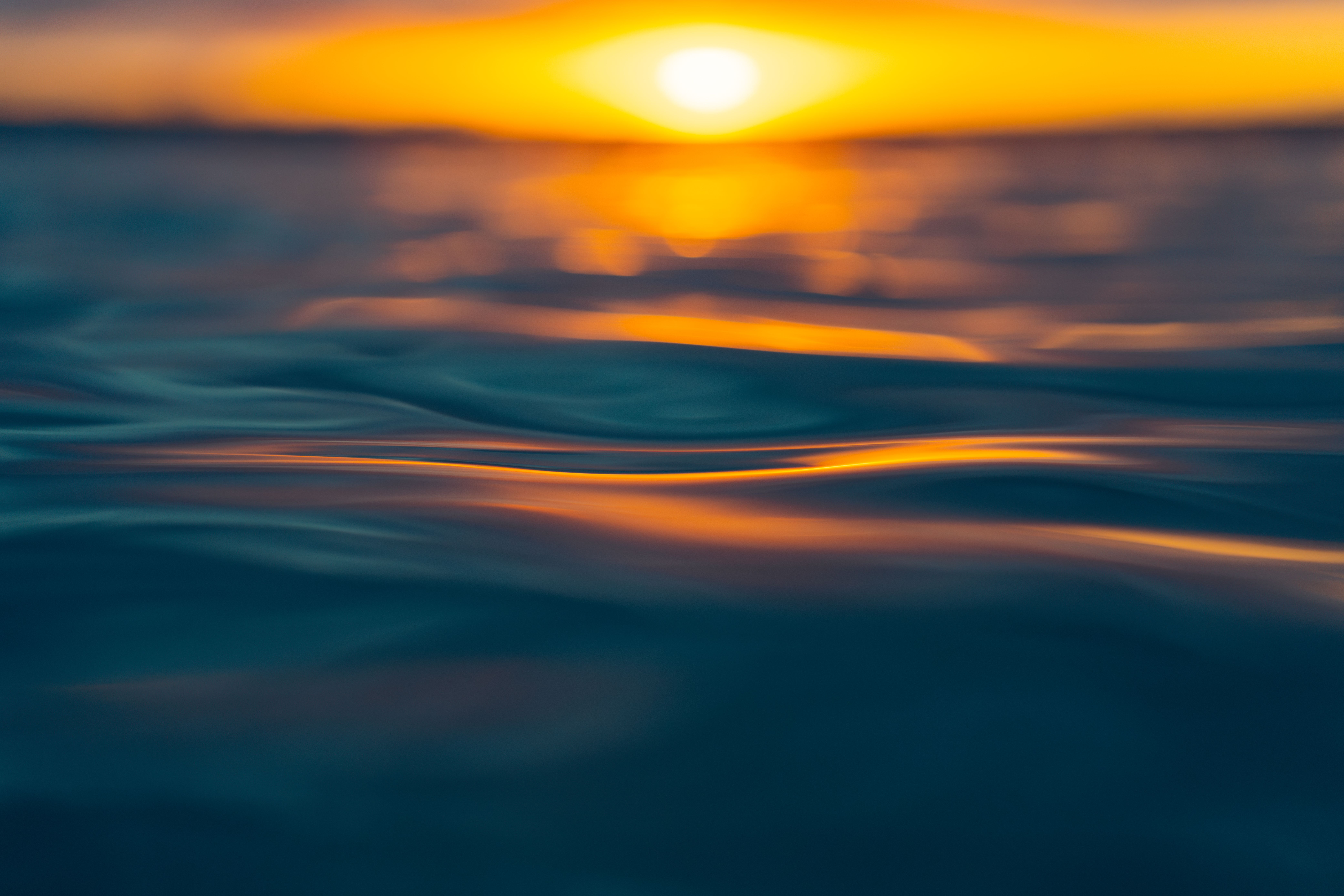 Serene Sunset Over Ocean Waves · Free Stock Photo