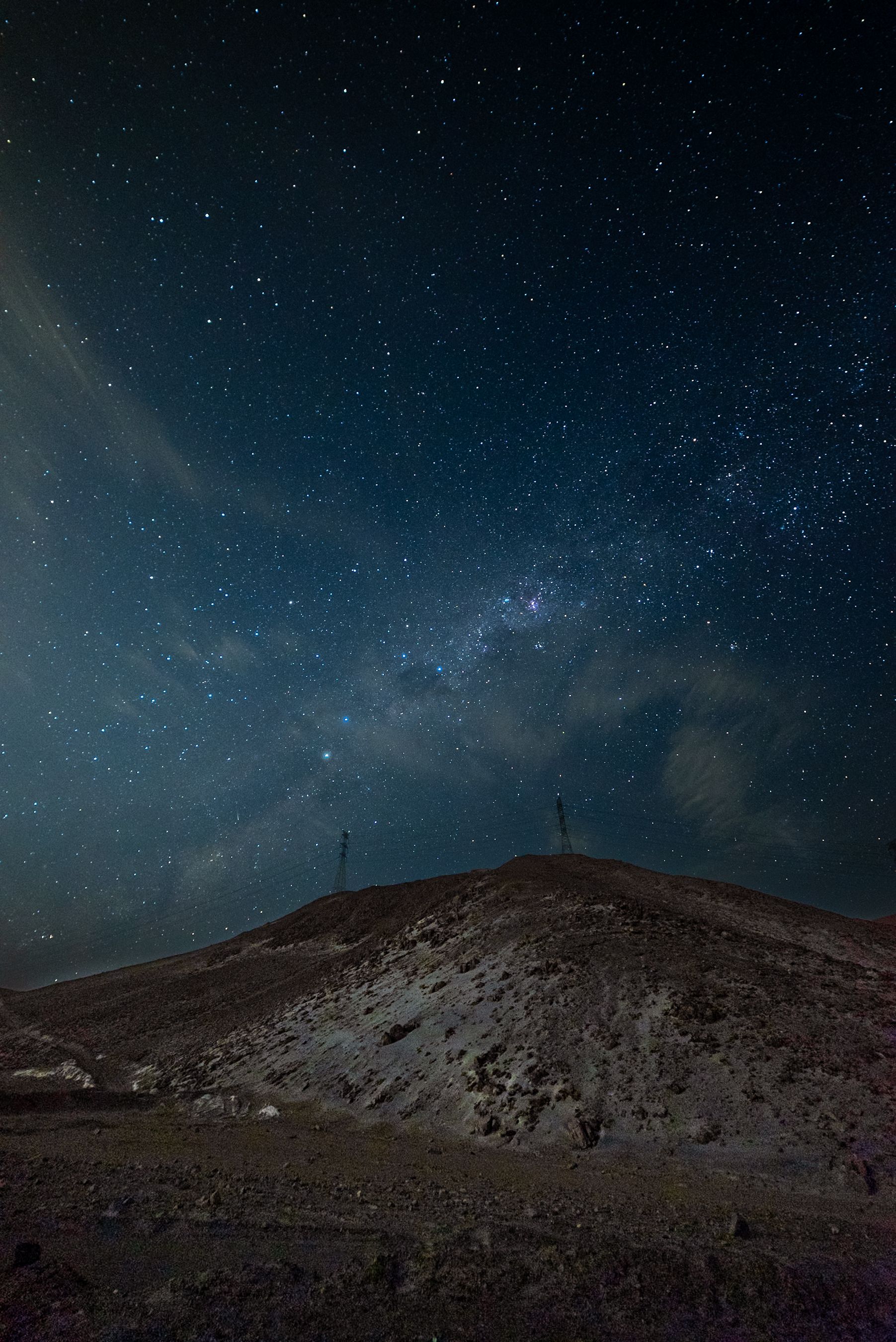 Star-filled night sky over a mountain landscape in Arequipa, Peru (illustrative)