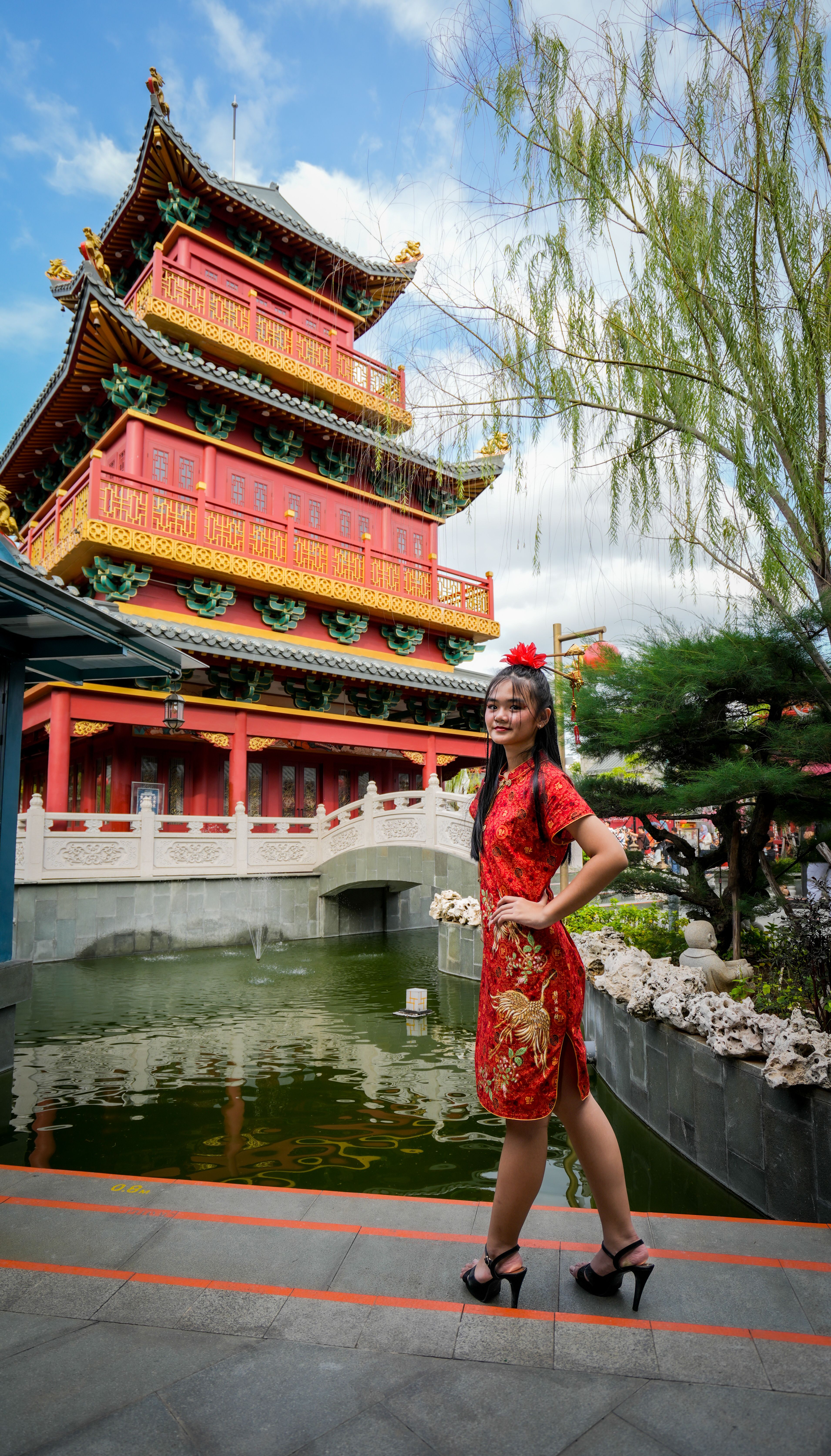 Asian Woman in Traditional Dress by Chinese Temple