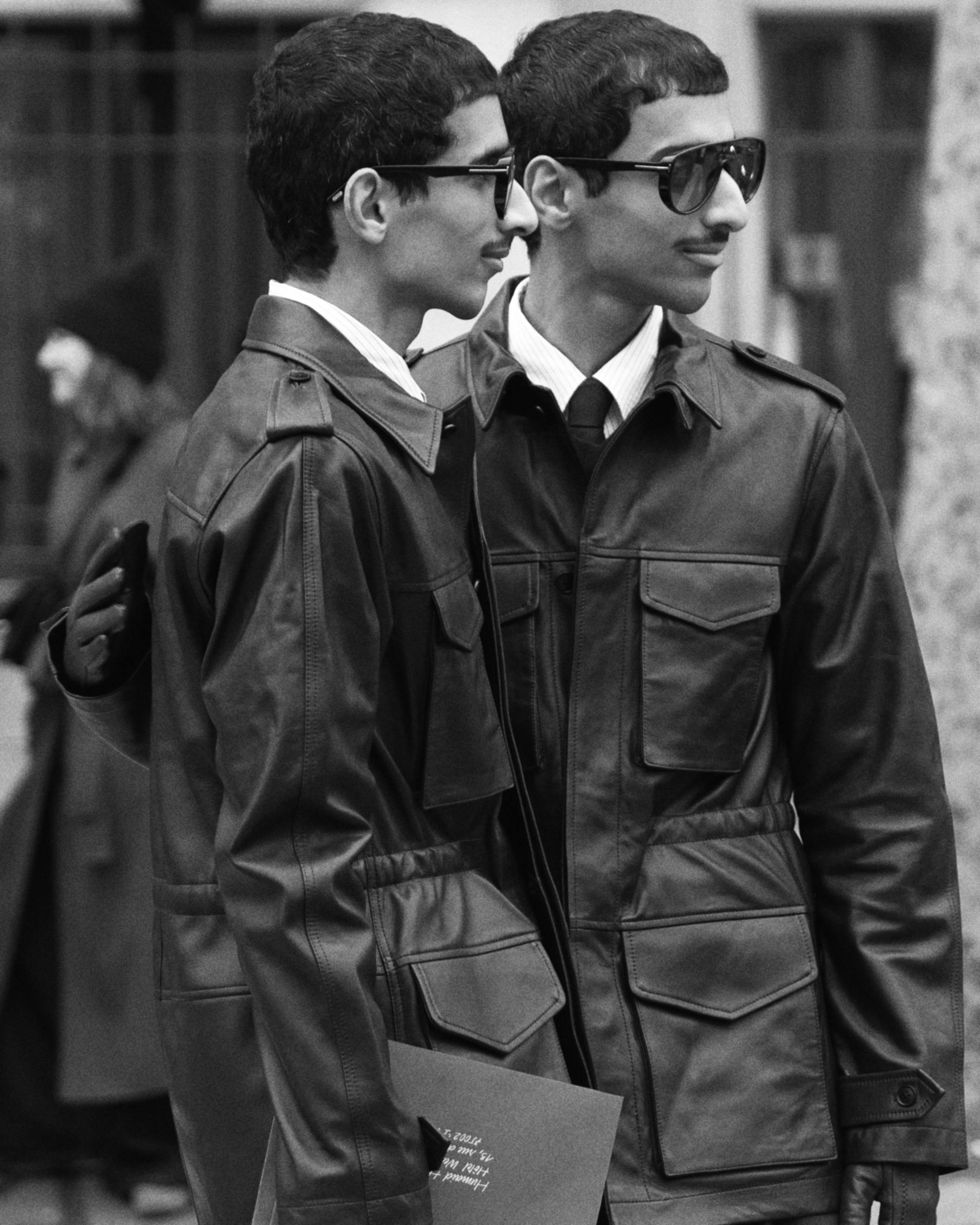 Free Two stylish men in leather jackets captured in Paris, showcasing modern fashion. Stock Photo
