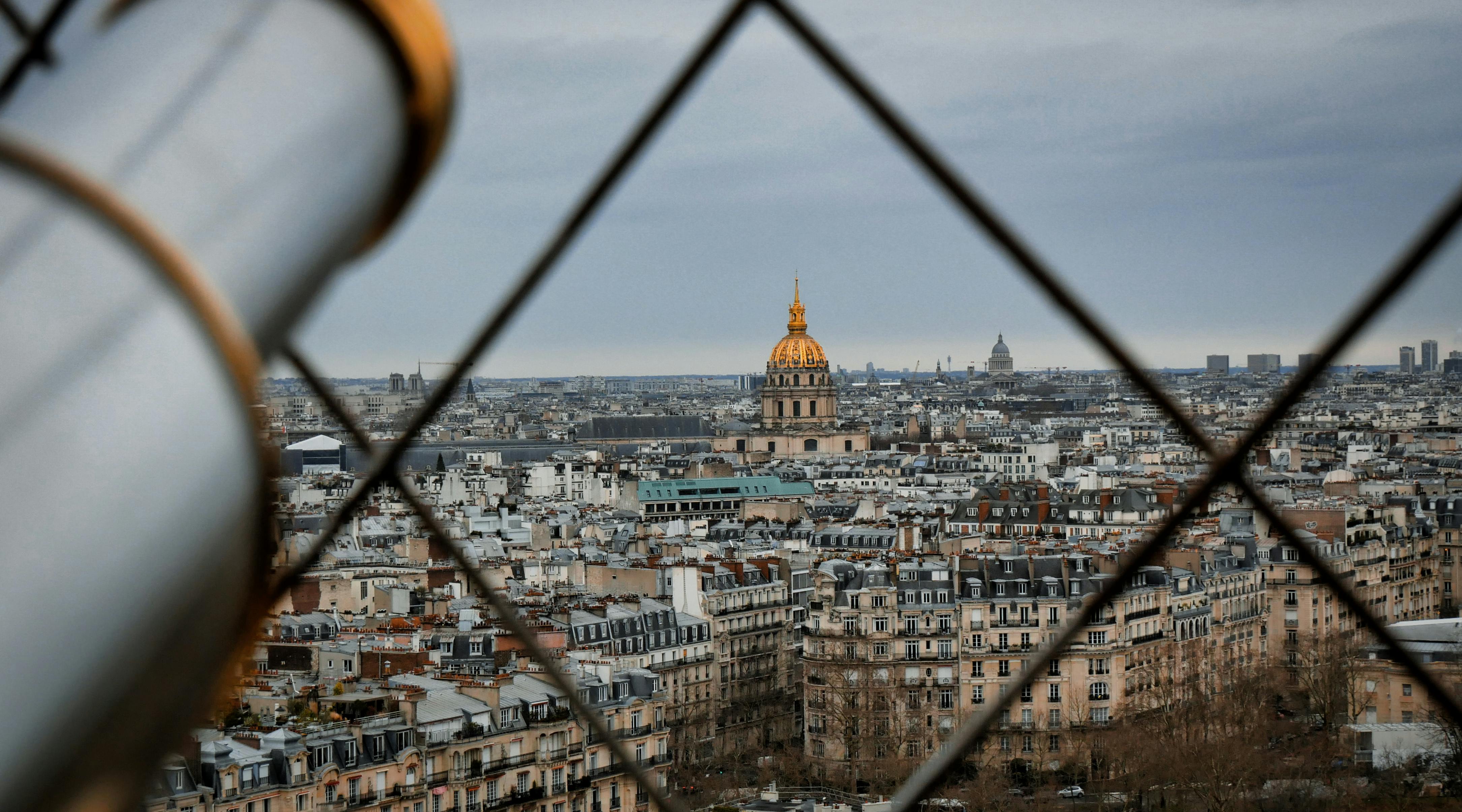 Eiffel Tower at golden hour with Champ de Mars gardens in foreground