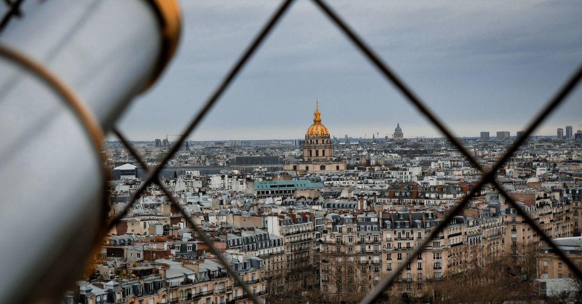 Eiffel Tower at golden hour with Champ de Mars gardens in foreground
