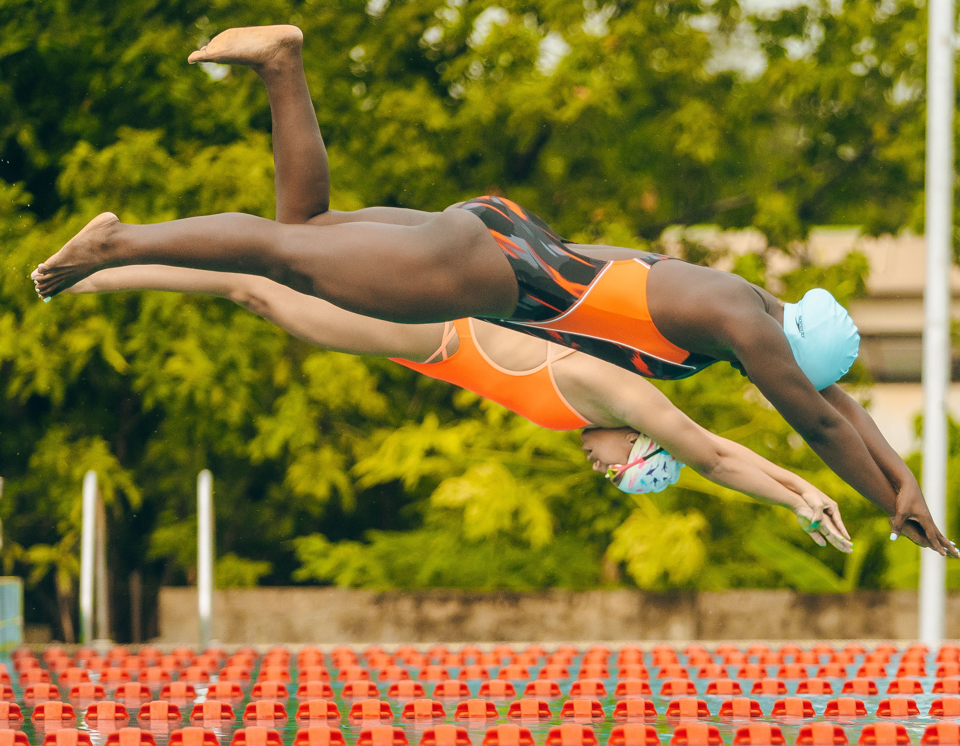 Dynamic Dive of Two Female Swimmers in Lagos · Free Stock Photo