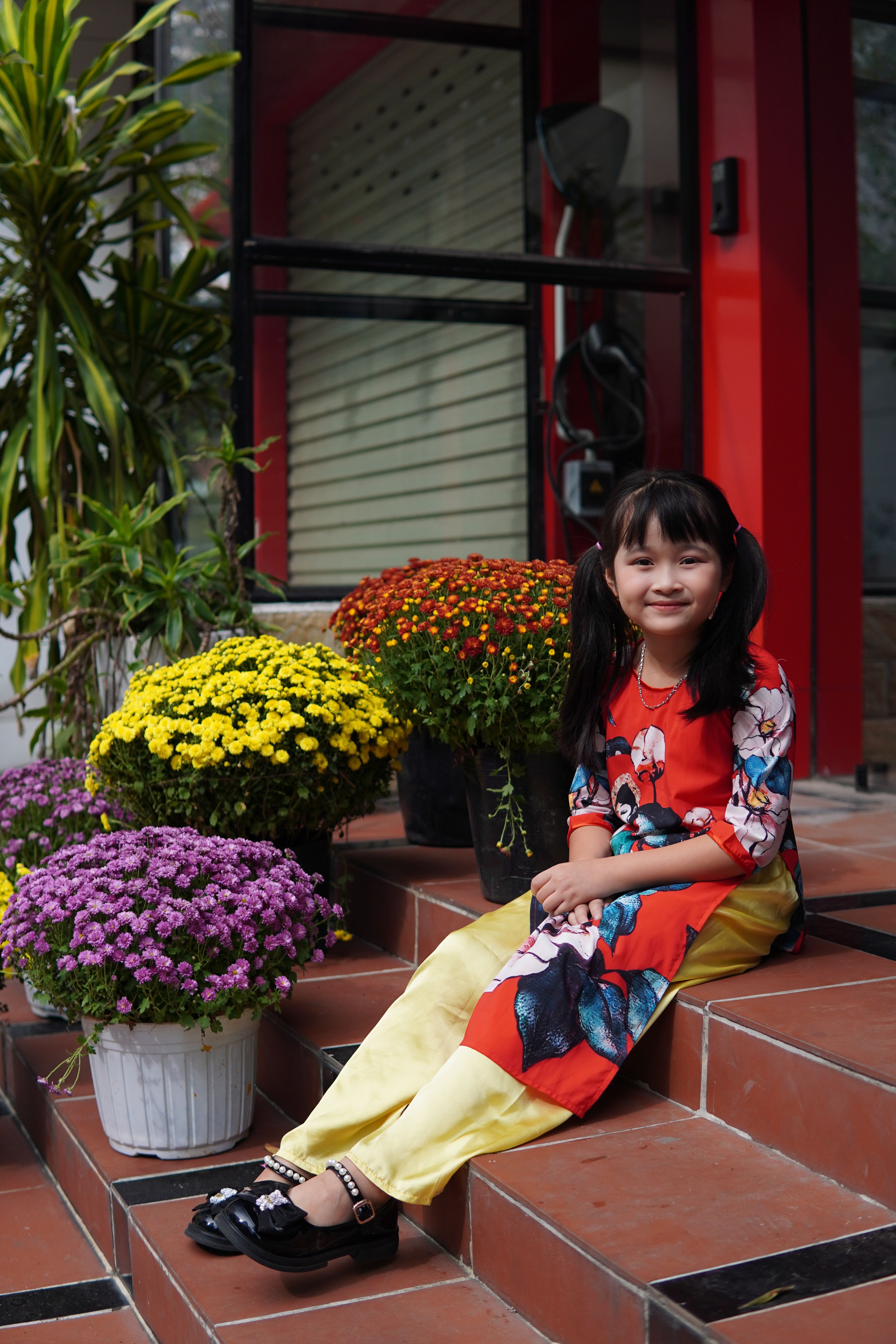 Smiling Girl in Traditional Dress with Flowers · Free Stock Photo