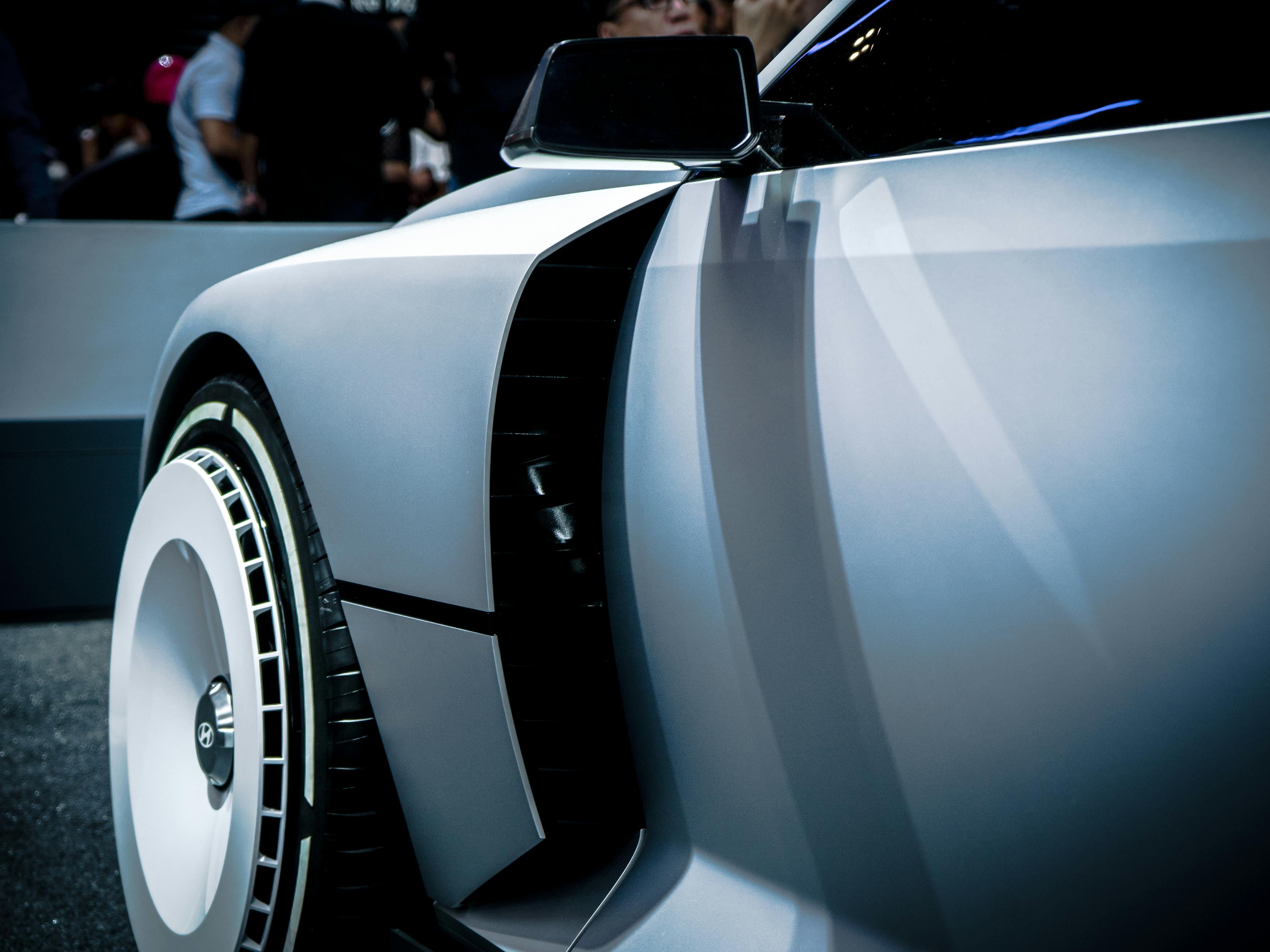 Sleek futuristic concept car showcased in Jakarta. Modern automotive design and innovation.