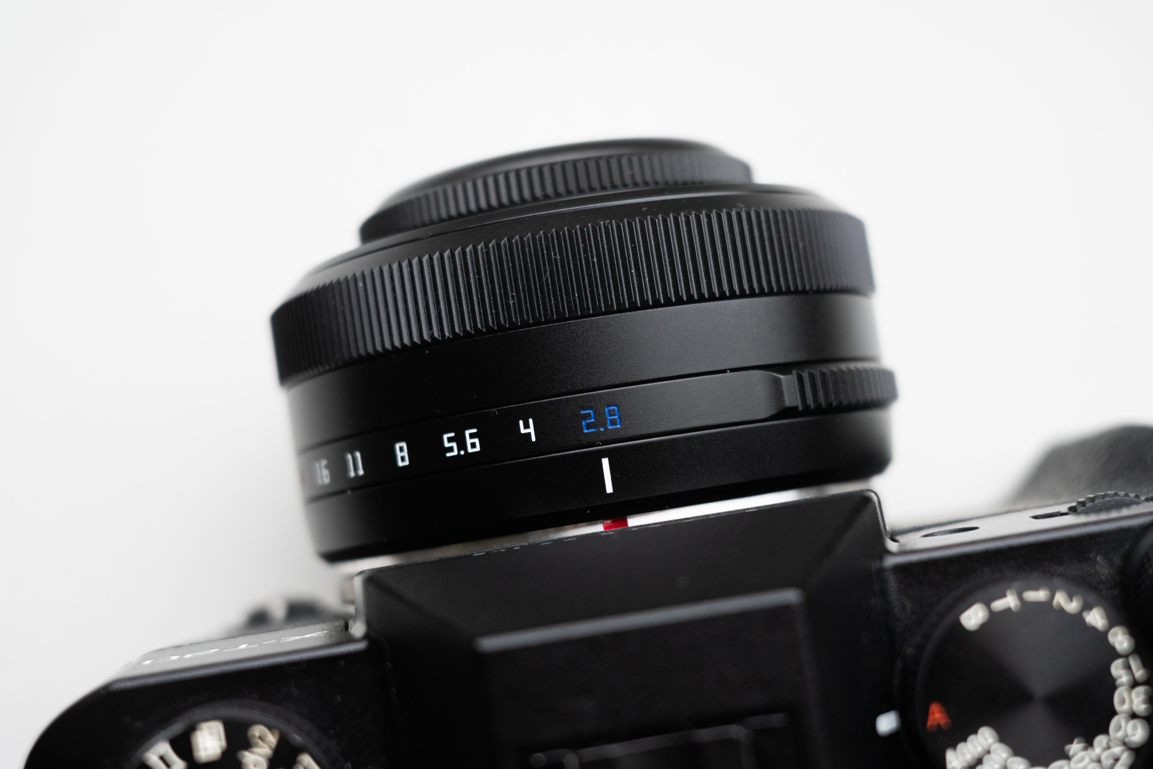 Detailed photo showcasing a camera lens with visible aperture settings in a macro view.