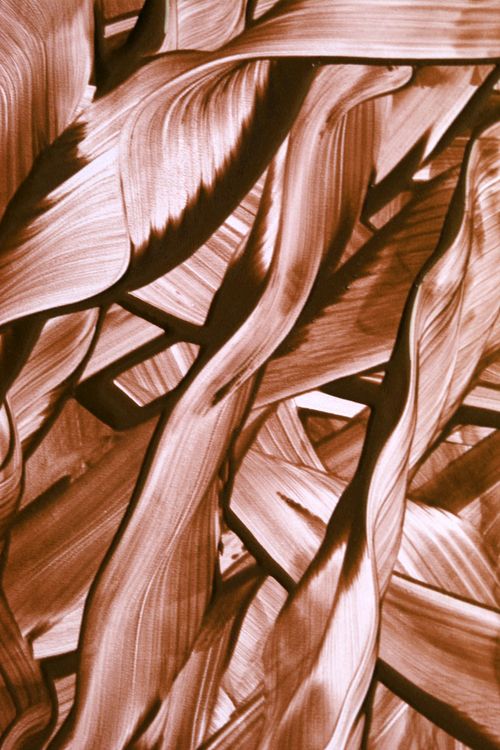 Free An abstract close-up of swirling brown painted brush strokes, creating an artistic pattern. Stock Photo