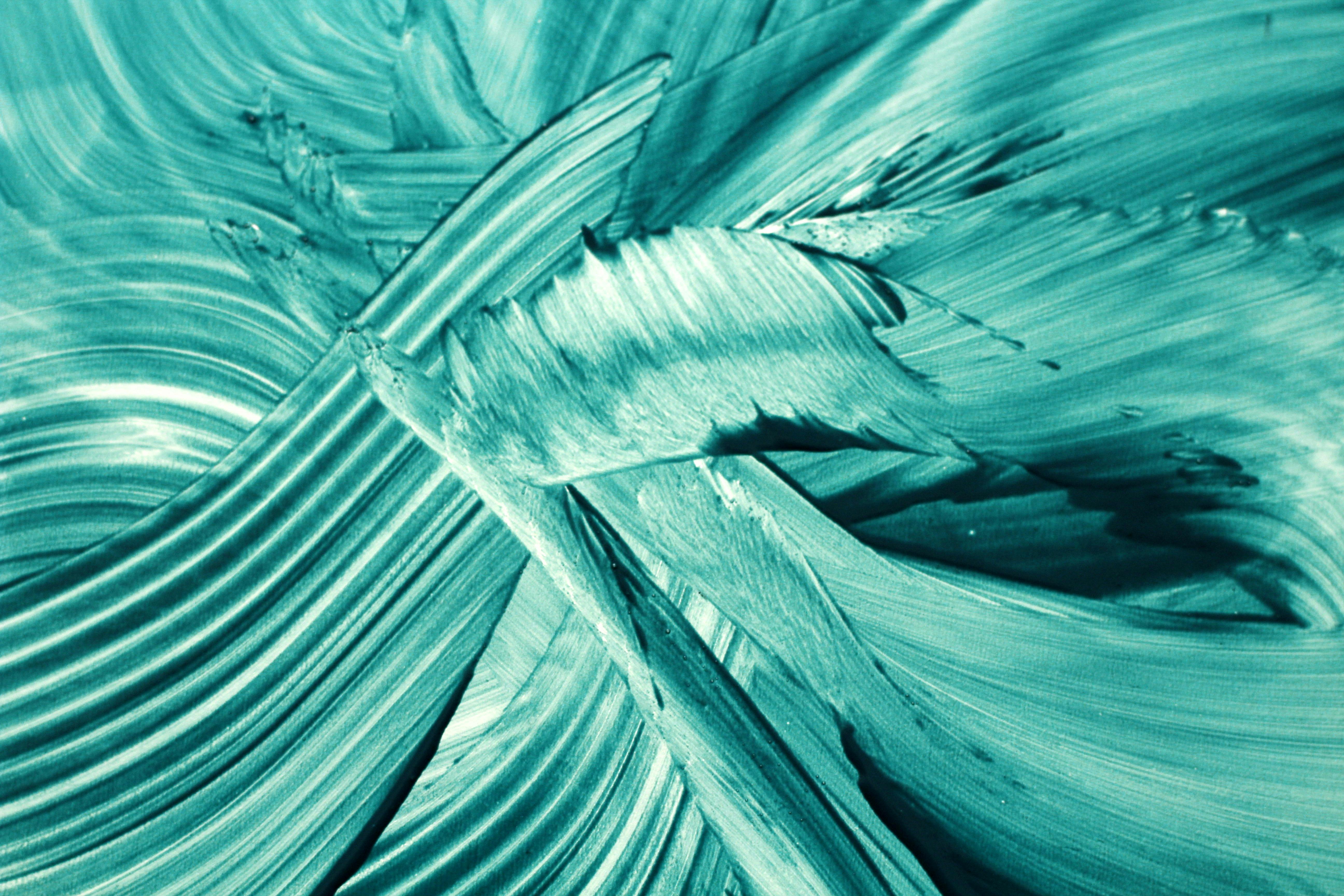 Dynamic abstract painting with vibrant turquoise brushstrokes, offering a modern artistic flair.