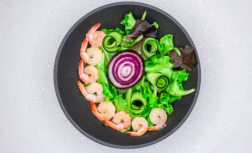 Close-up Of A Steamed Shrimp Salad With Fresh Vegetables In A Metal Bowl