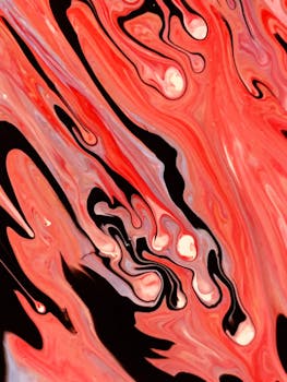 动态抽象绘画通过生动的红色和黑色漩涡，创造出一种运动和流动的感觉