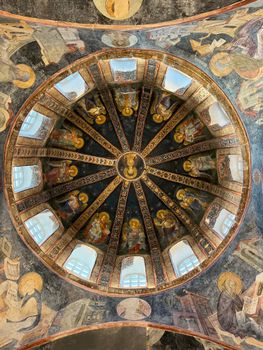 A beautifully detailed Byzantine dome featuring religious iconography, showcasing intricate historical frescoes.